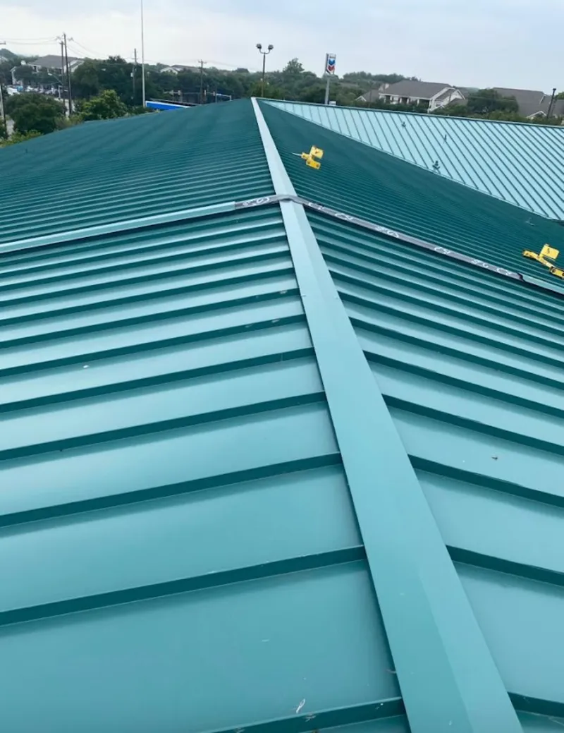 Green commercial metal roof ridge and valley for Metal Roof Repair in Sedalia